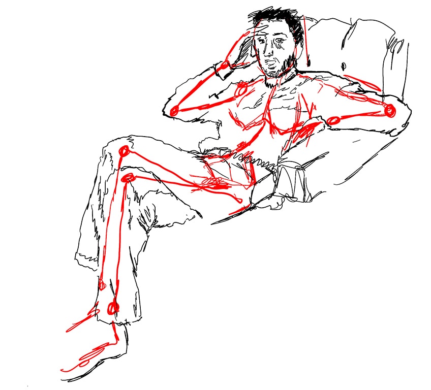 man sitting down drawing