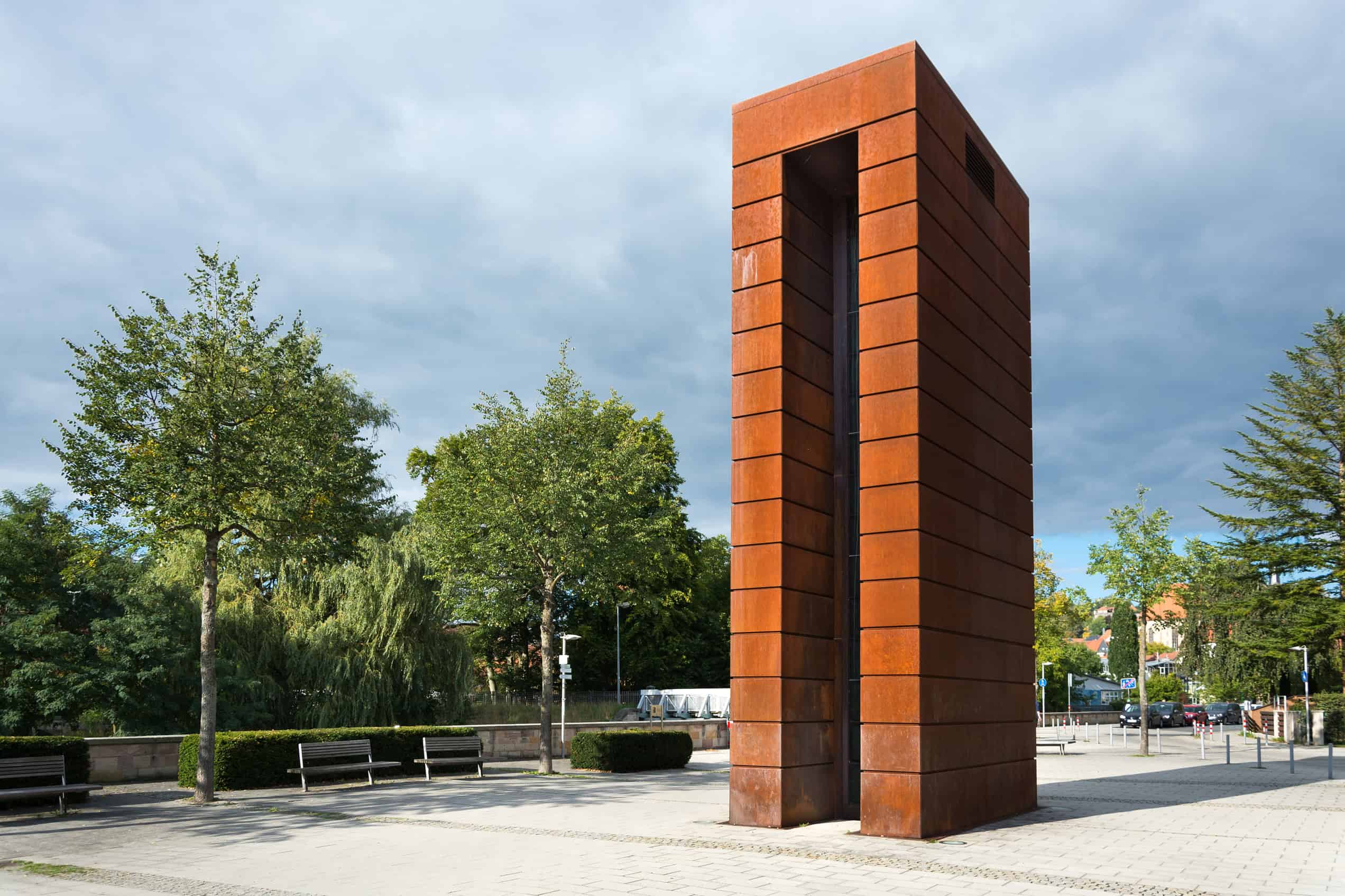 The Plessi tower at the entrance to the Landesgartenschau grounds in Kronach, a tall steel structure filled with television screens, seen against the sky in September 2015.