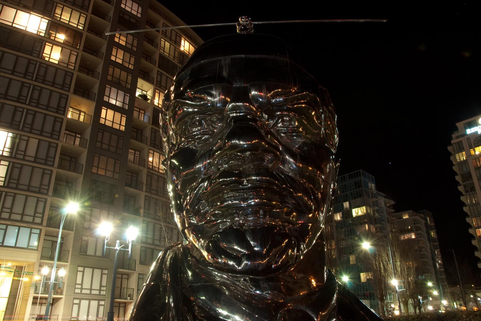 The Gao Brothers’ brightly colored Miss Mao sculpture balances on a monumental bust of Lenin at the 2010 Vancouver Biennale.