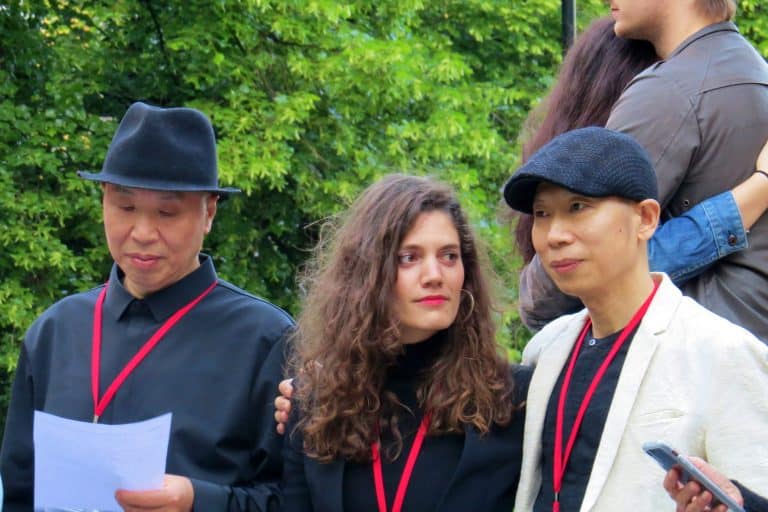 Gao Zhen and Gao Qiang stand with Dagmar Carnevale Lavezzoli during their Utopia of the Embrace performance in Oslo in 2019.