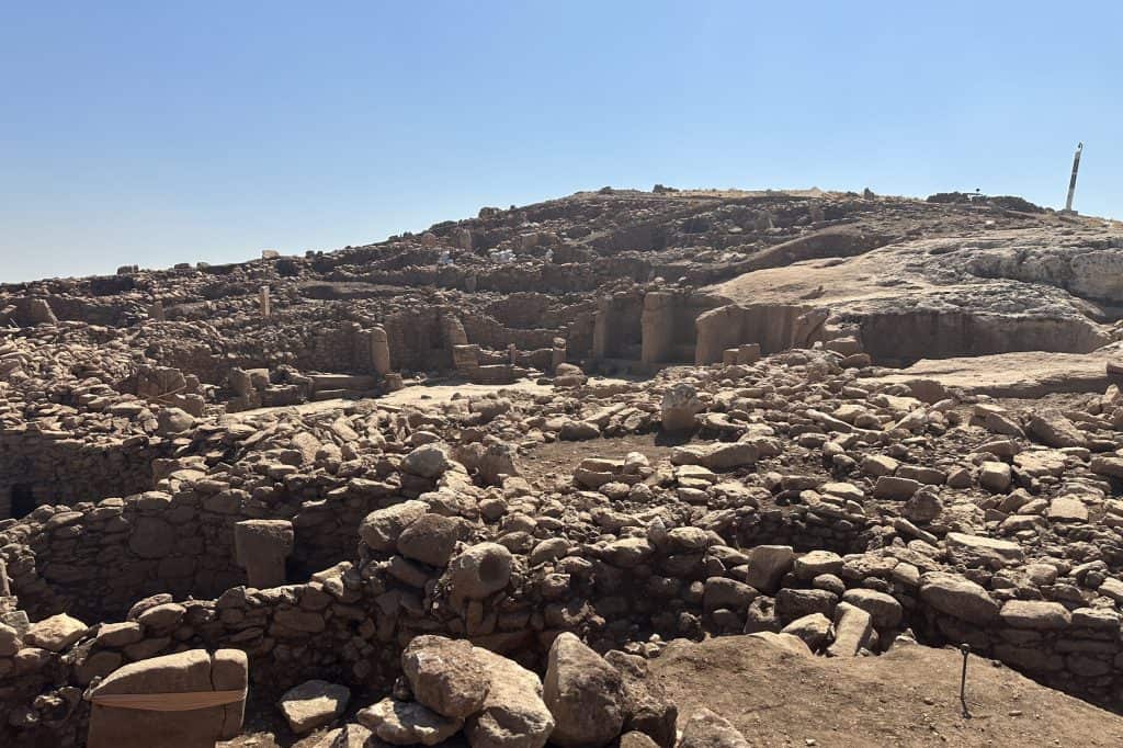 A broad view across the exposed archaeological remains at Karahantepe in southeastern Türkiye.