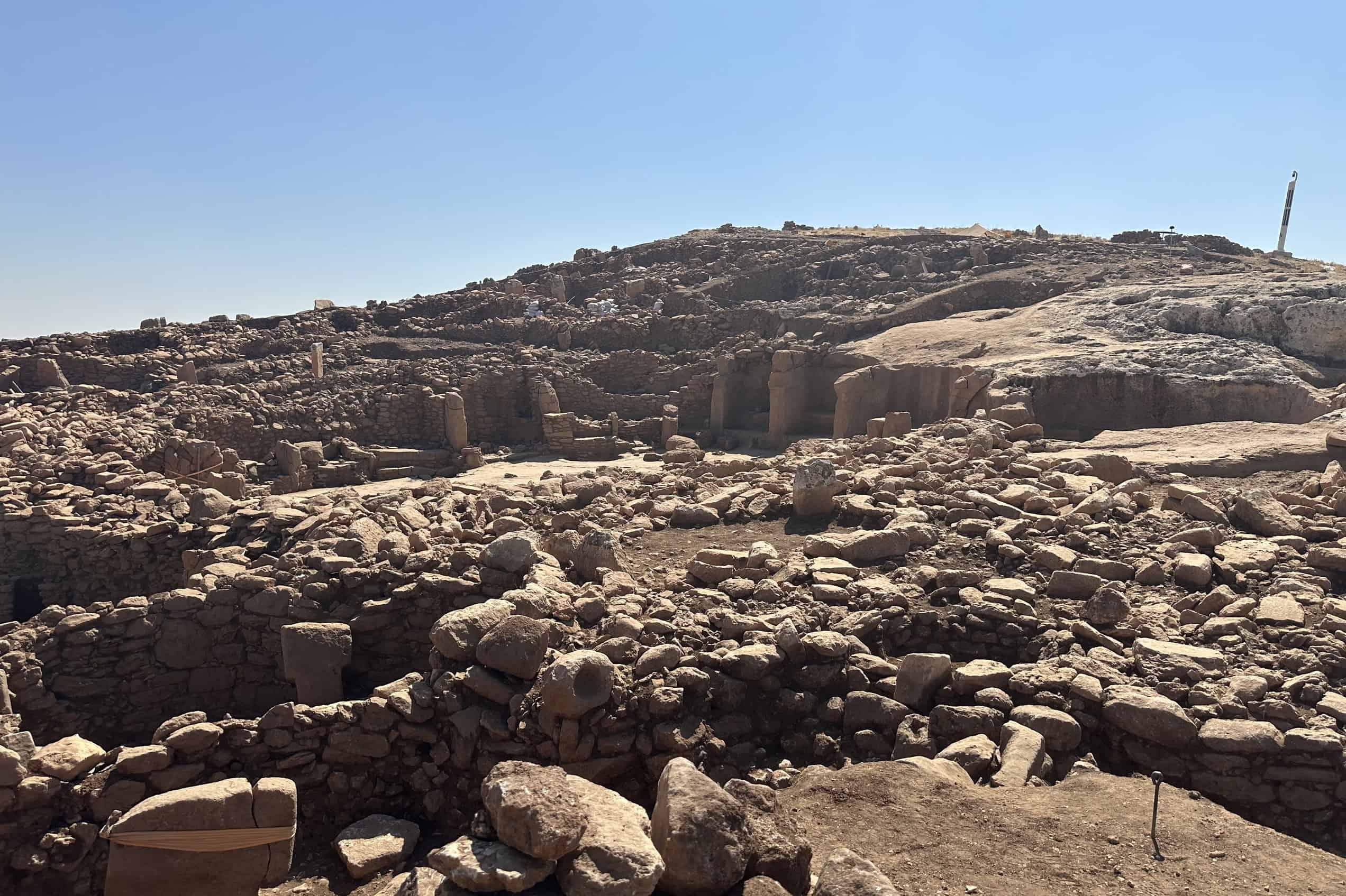 A broad view across the exposed archaeological remains at Karahantepe in southeastern Türkiye.
