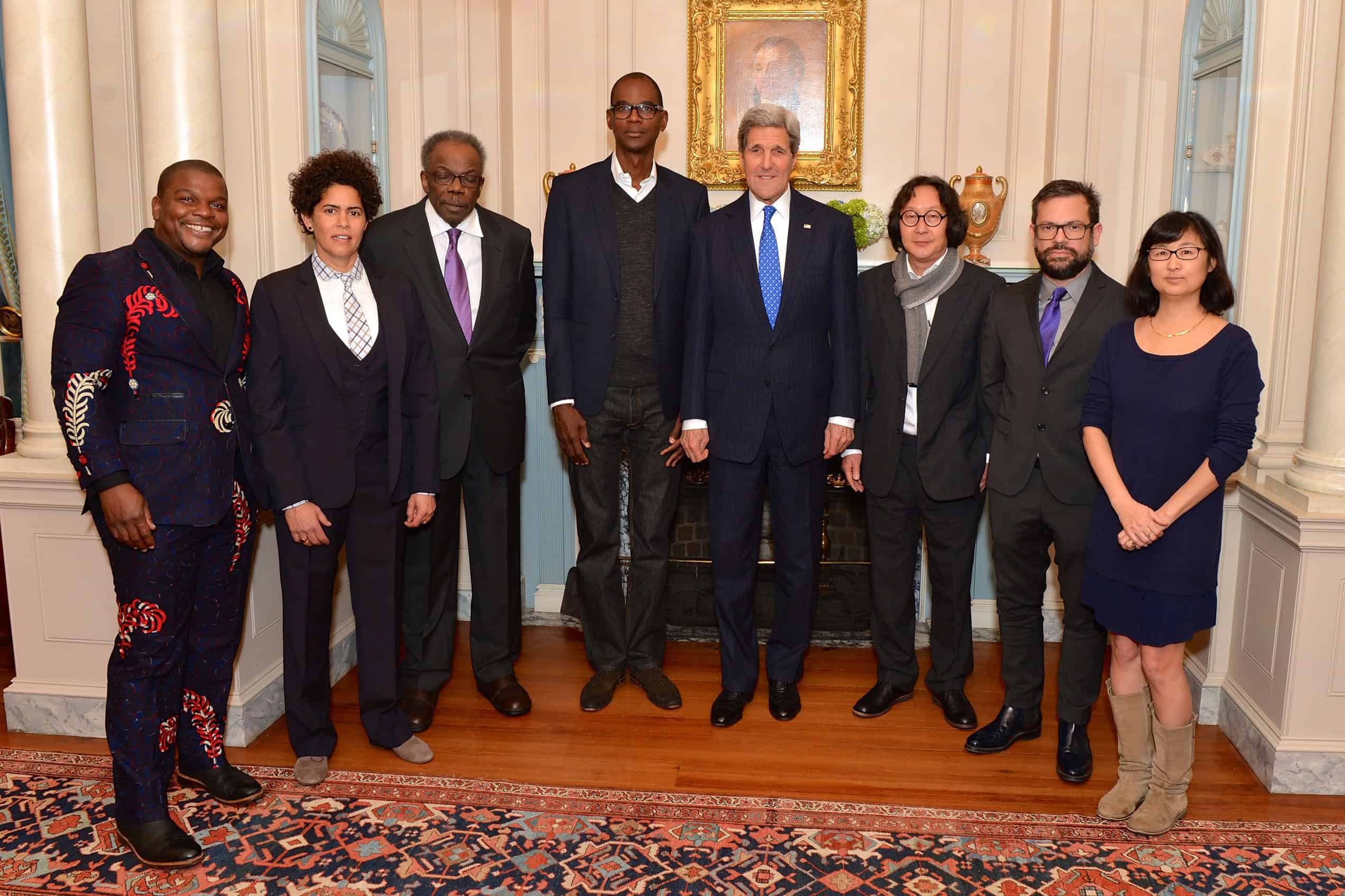 Secretary of State John Kerry stands with the seven artists who received the U.S. Department of State Medal of Arts, among them Kehinde Wiley, at the State Department in Washington in January 2015.