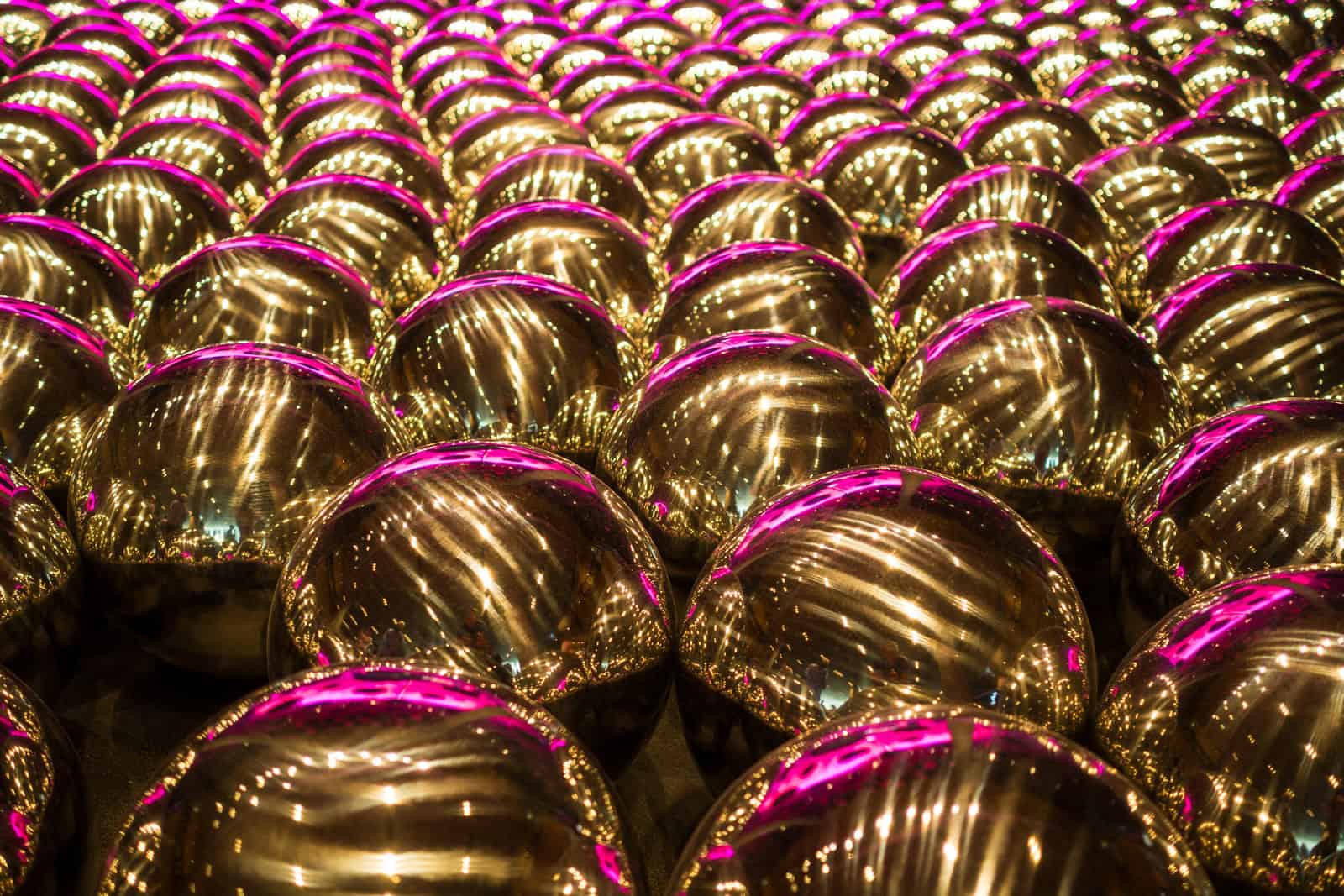 Reflective silver spheres from Yayoi Kusama’s Narcissus Garden cover a gallery floor at the National Gallery of Victoria.