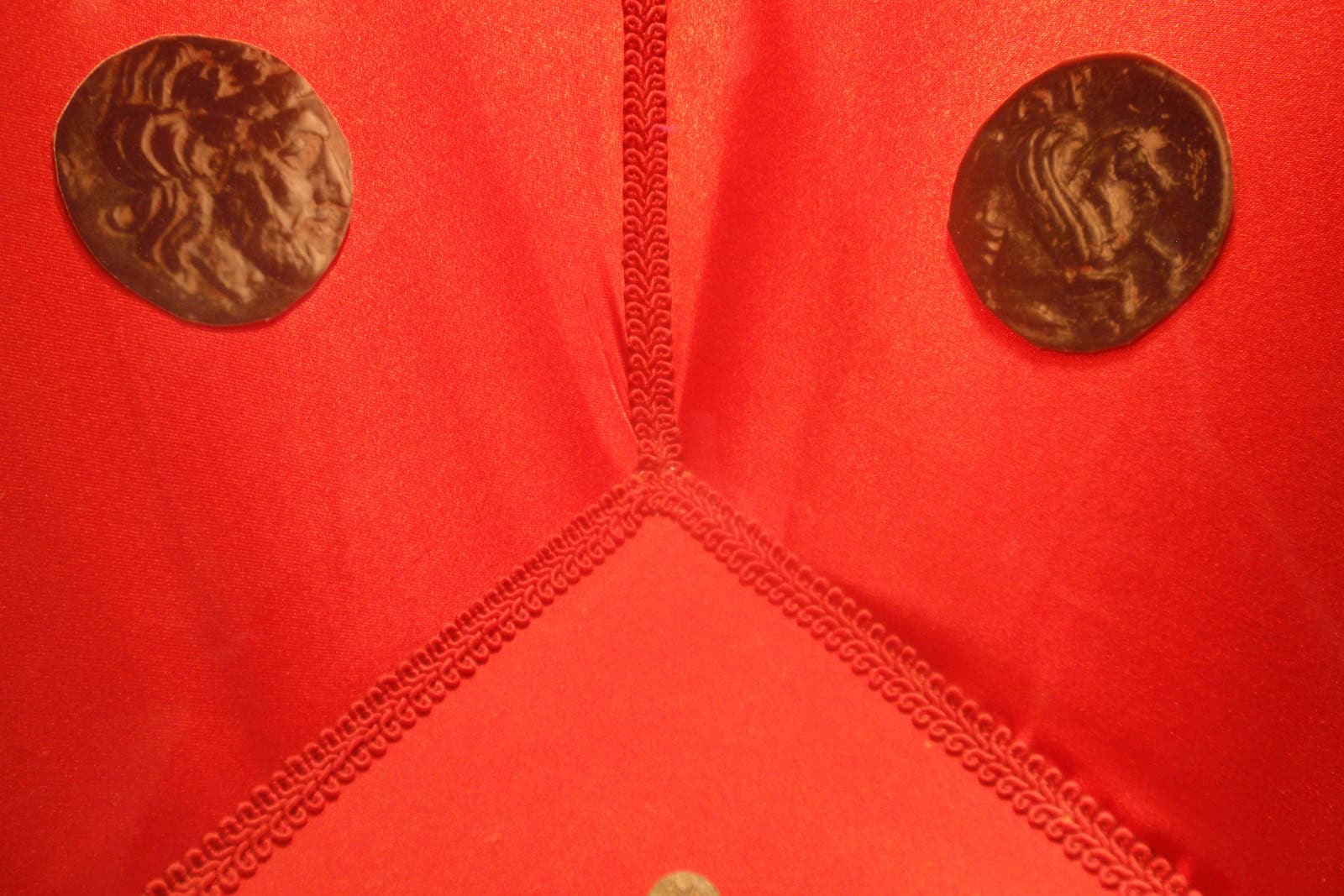 A displayed ancient coin from Adramytteion shows Zeus on one face and the winged horse Pegasus on the other.