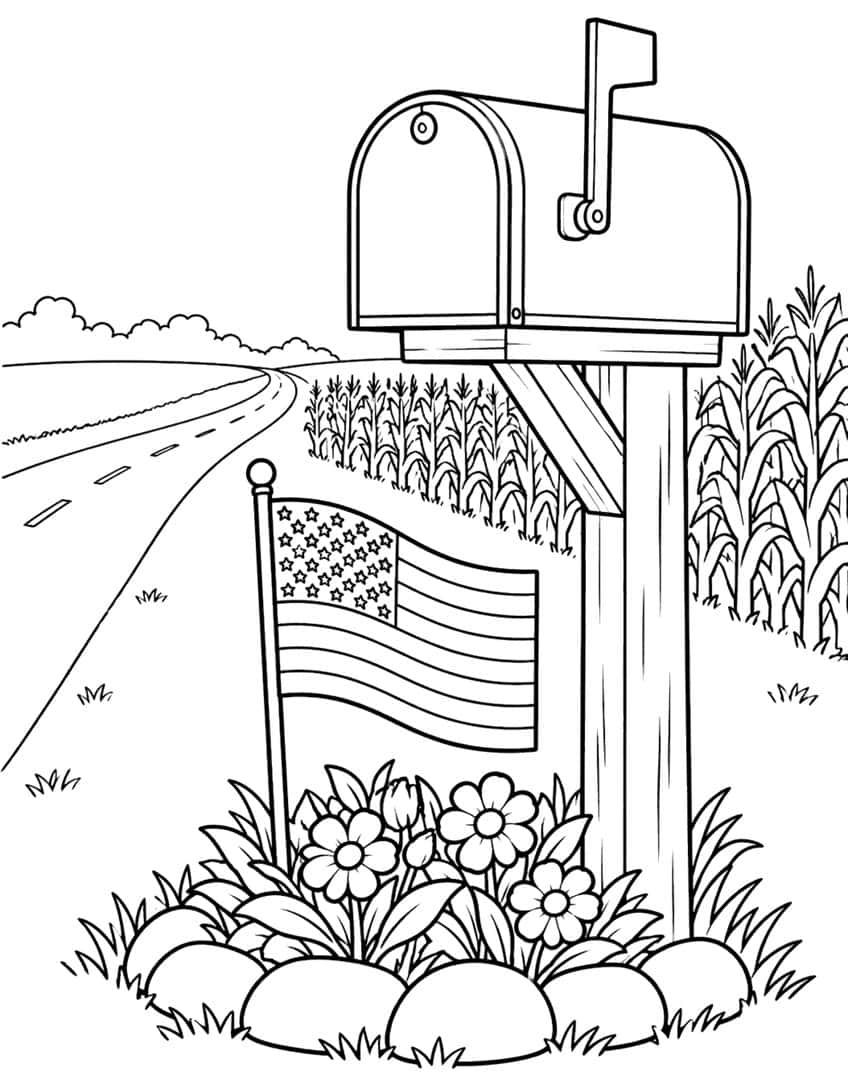 Mailbox on a wooden post with a small American flag, flower bed, cornfield and country road