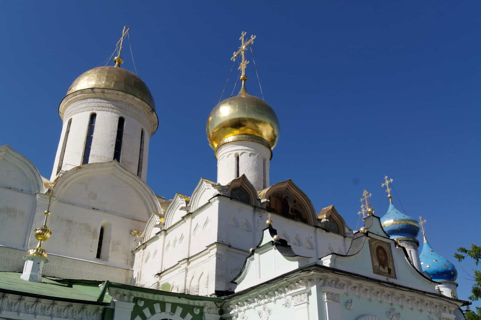 The white-walled Trinity Cathedral and its gold domes stand within the Trinity Lavra of St. Sergius.