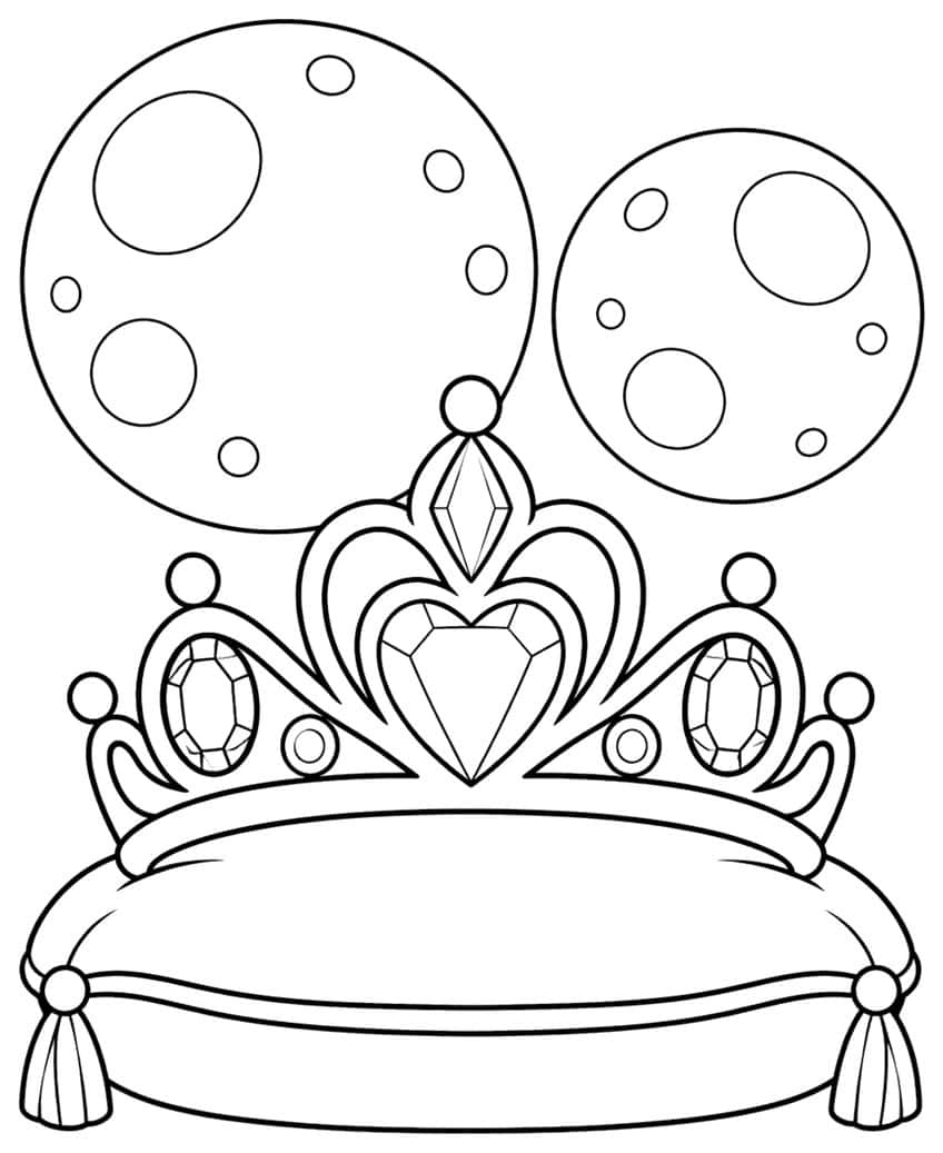Tiara with heart gem on a tasseled cushion in front of two cratered moons