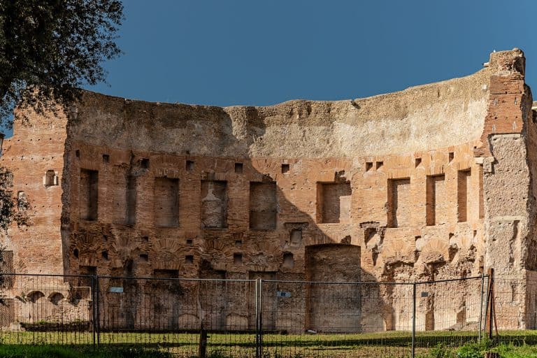 Ancient brick walls rise within an exedra of the Baths of Trajan on Rome’s Oppian Hill.