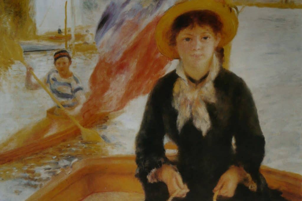 Pierre-Auguste Renoir’s En canot shows a young woman in a yellow hat seated in a narrow boat on blue-green water.