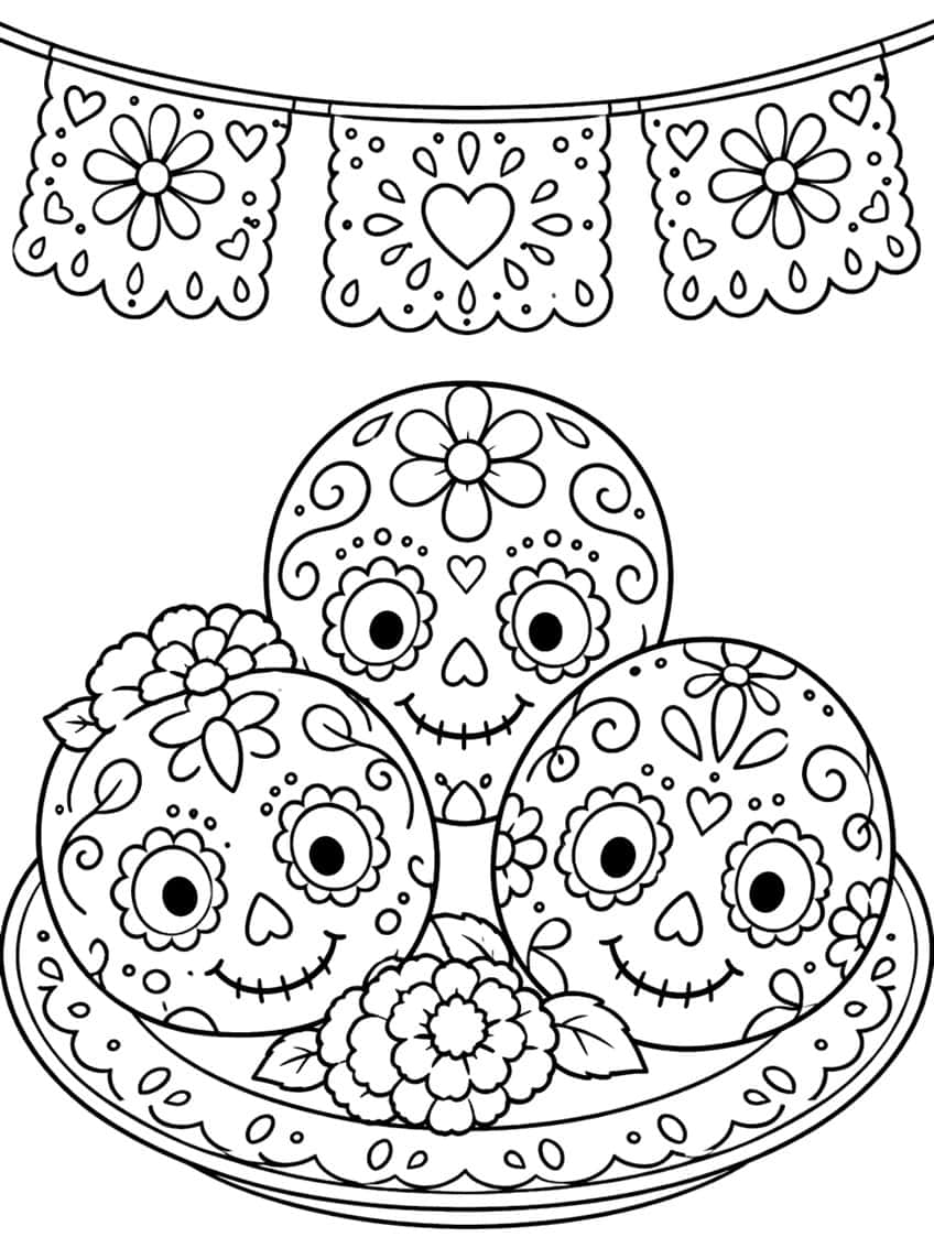 Three smiling sugar skulls on a decorated plate with a marigold and a papel picado banner above