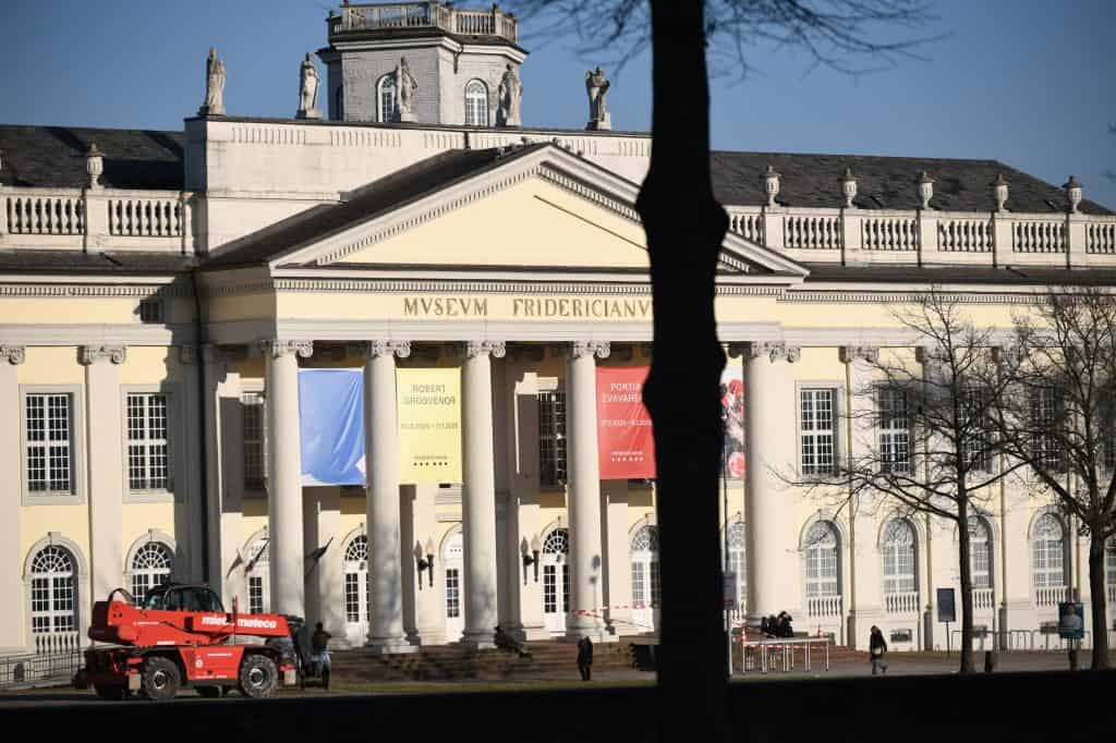 The pale neoclassical façade of the Fridericianum stands in winter sunlight on Friedrichsplatz in Kassel.
