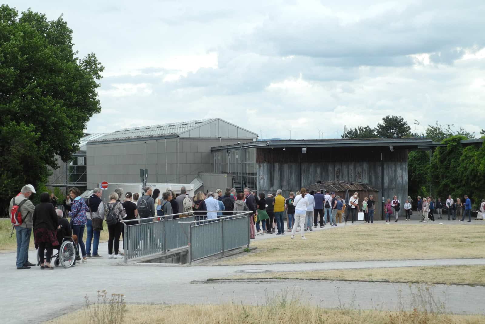Visitors queue outside Documenta Halle during Documenta 15 in Kassel in July 2022.