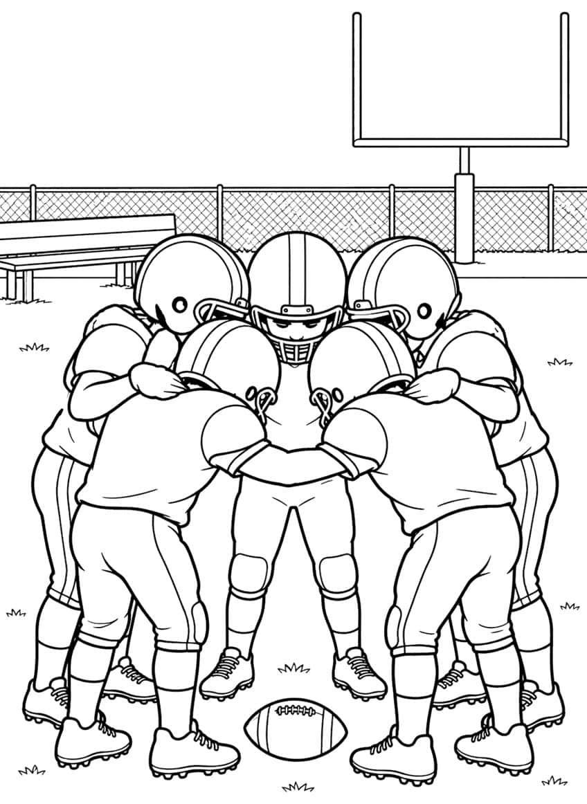 Five football players in a huddle with a football on the grass, a fence, a bench and a goalpost behind