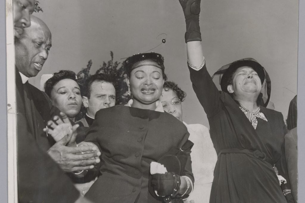 Mourners stand together at Burr Oak Cemetery during Emmett Till’s funeral on September 6, 1955.