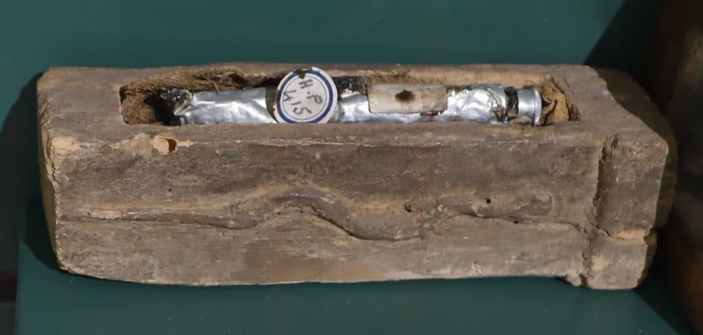 A tube of mummy brown displayed in a small coffin at Bolton Library and Museum Services.