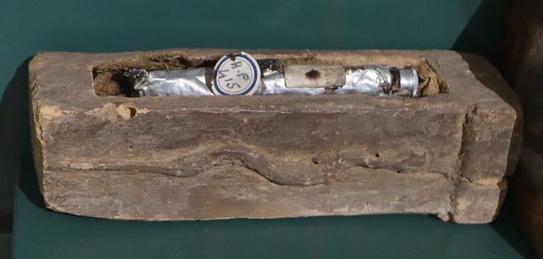 A tube of mummy brown displayed in a small coffin at Bolton Library and Museum Services.
