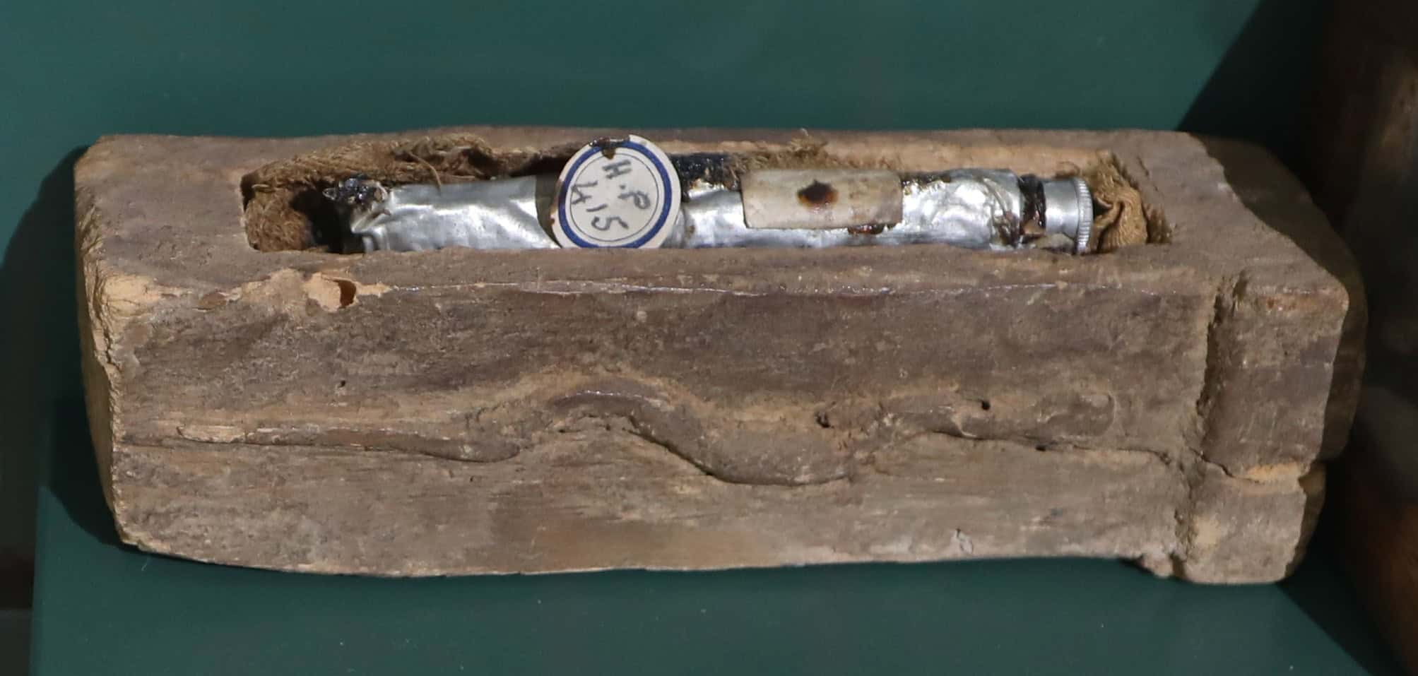 A tube of mummy brown displayed in a small coffin at Bolton Library and Museum Services.