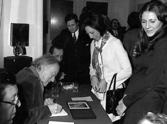 Paul Delvaux signs books in Brussels in January 1972.