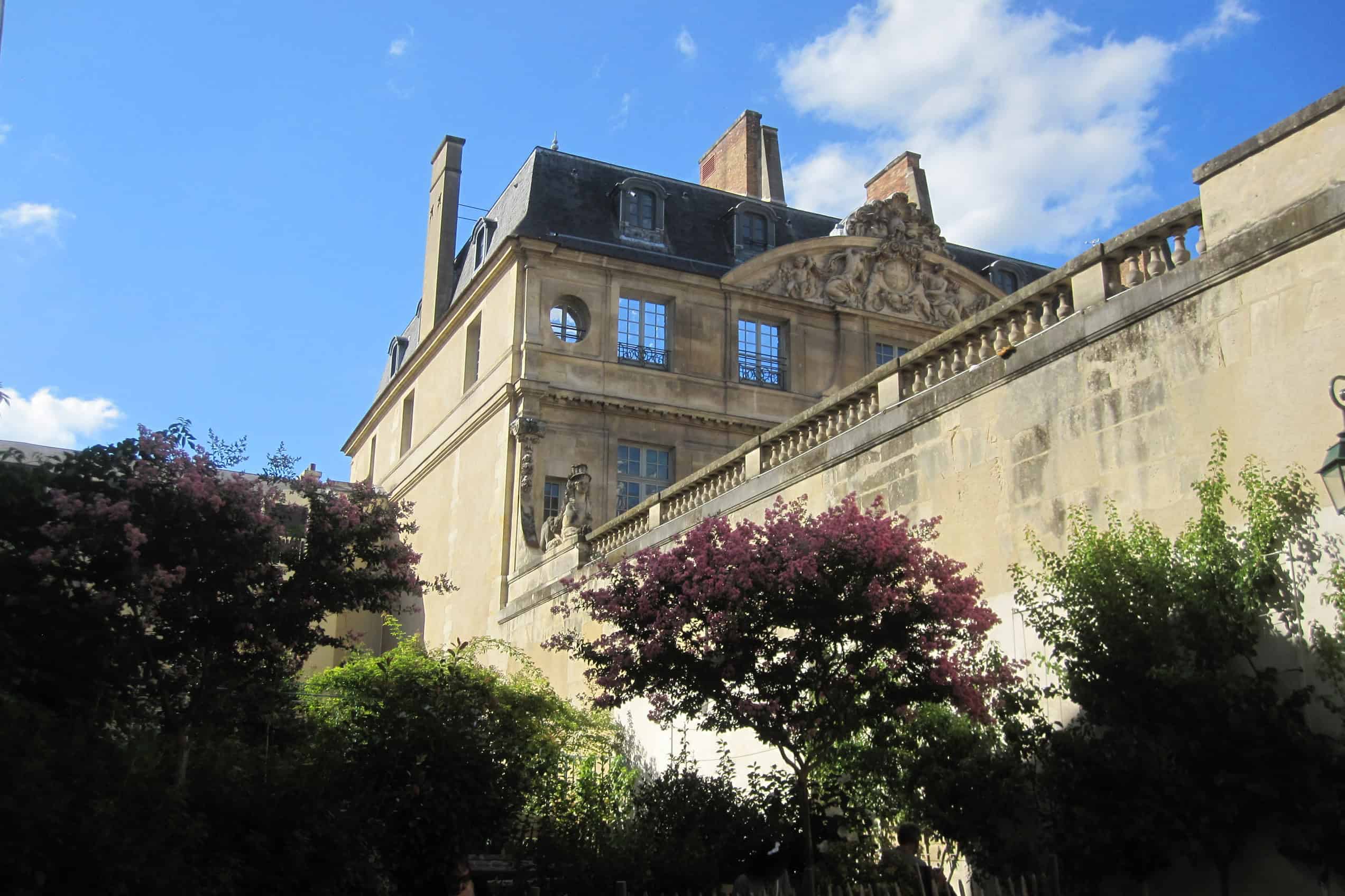 A side view of the Hôtel Salé, home of the Musée National Picasso-Paris, seen across its garden.