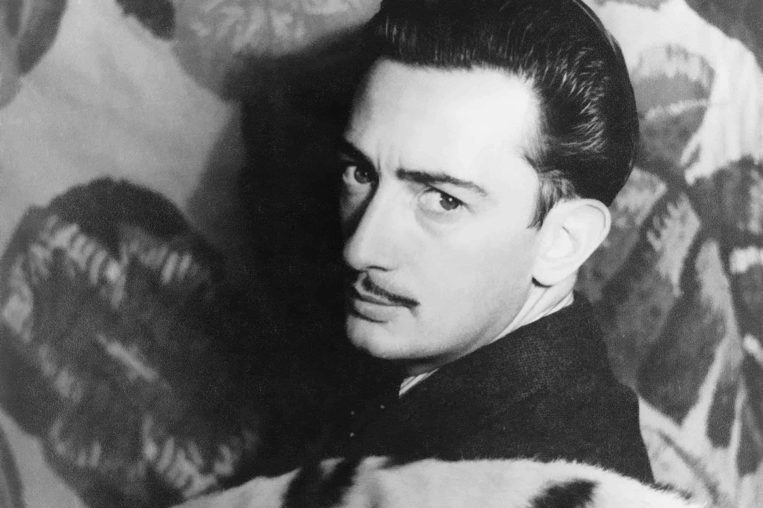 Salvador Dalí in a 1939 portrait, before the postwar turn that shaped his 1952 to 1954 reworking of the melting-watch scene.