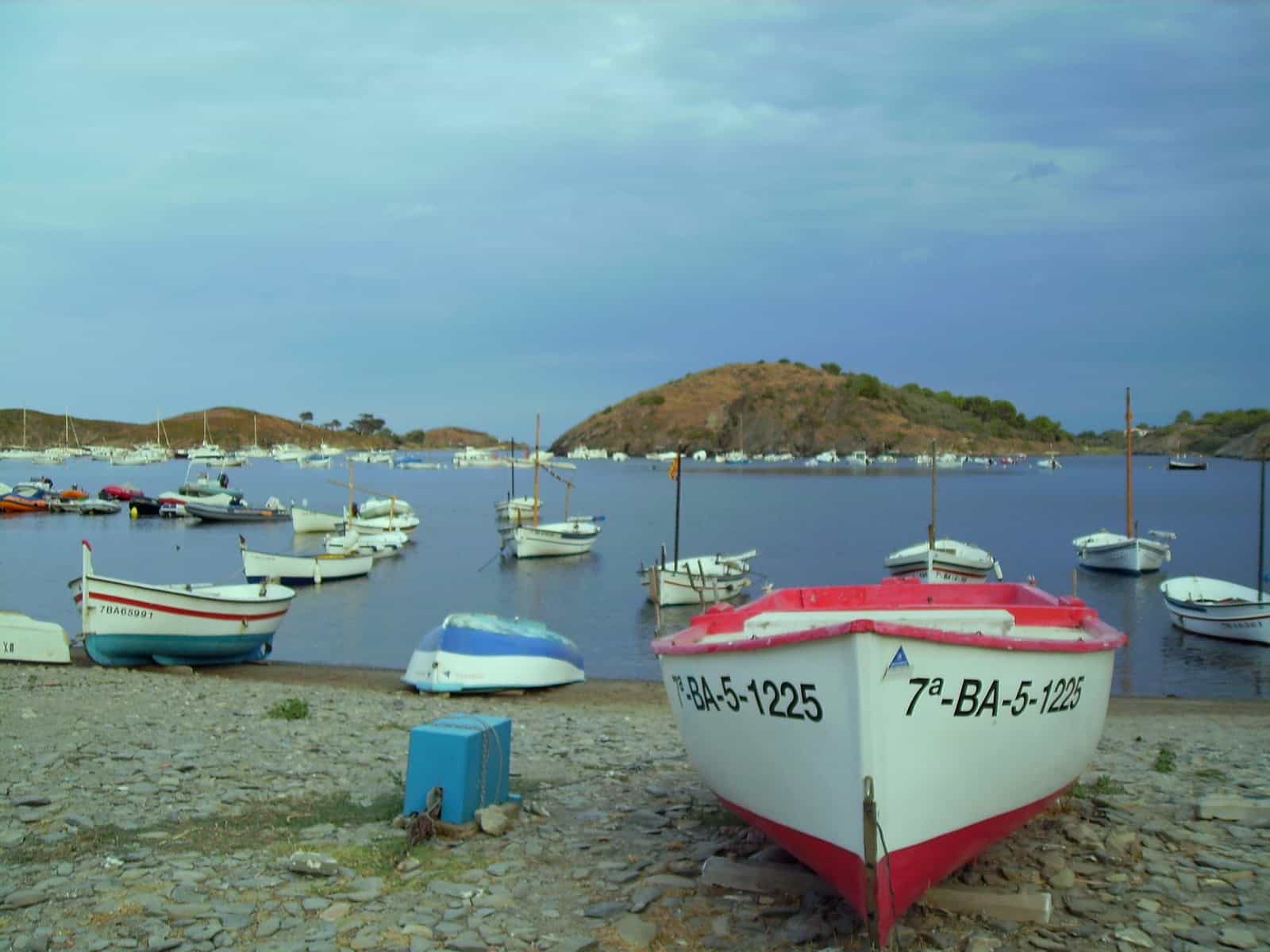 Portlligat in Cadaqués, the coastal setting that remains recognizable in Dalí's disintegrating landscape.