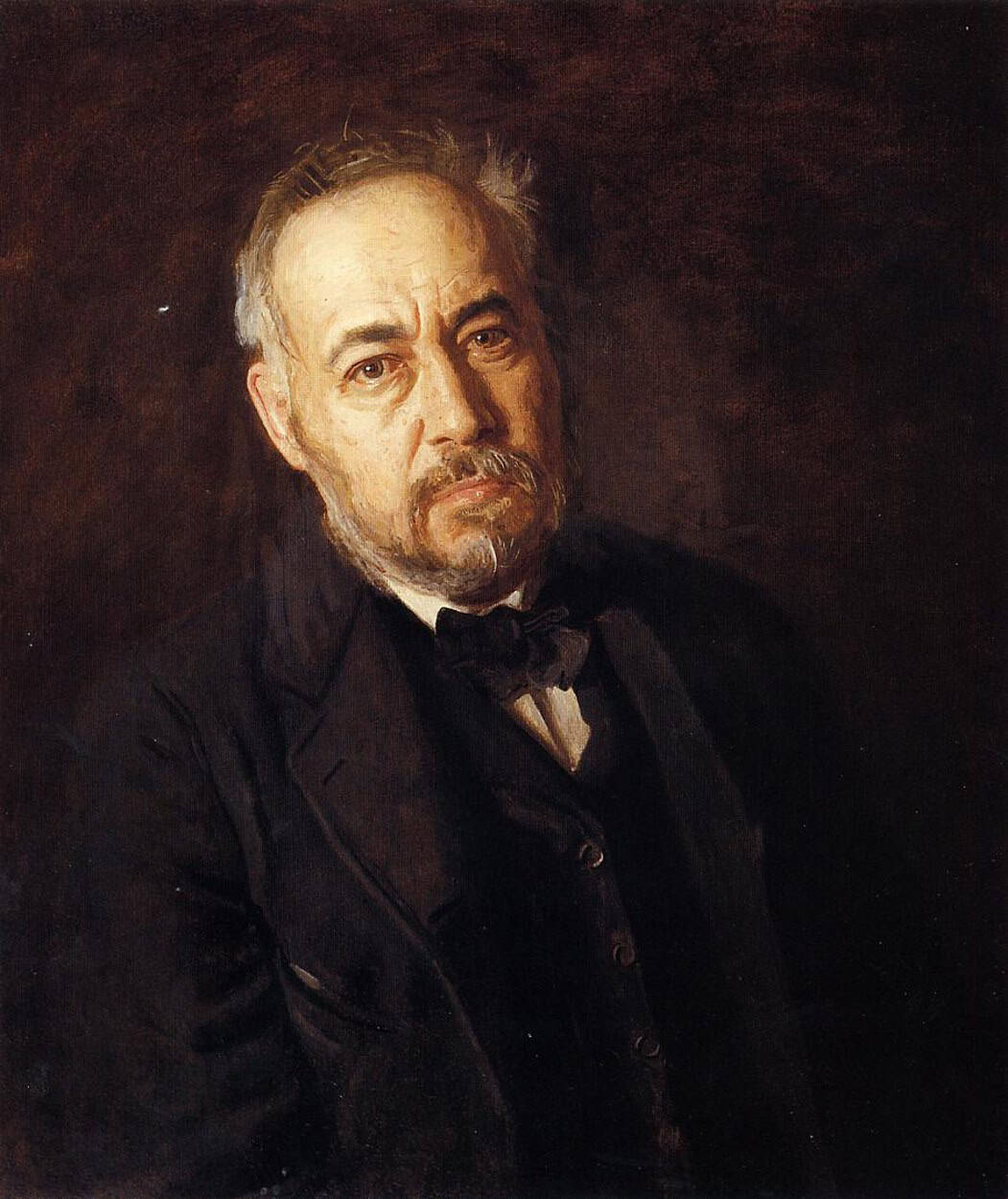 Thomas Eakins’s 1902 self-portrait presents the artist against a plain, dark ground.