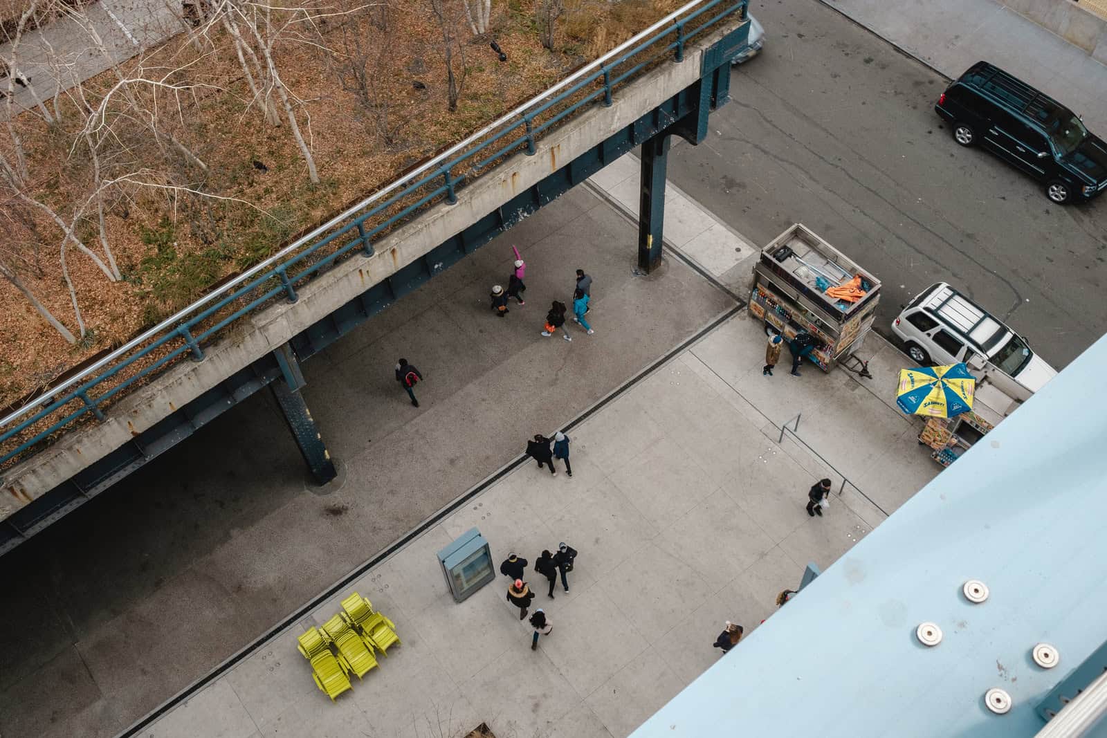 People crossing the square below the Whitney Museum of American Art