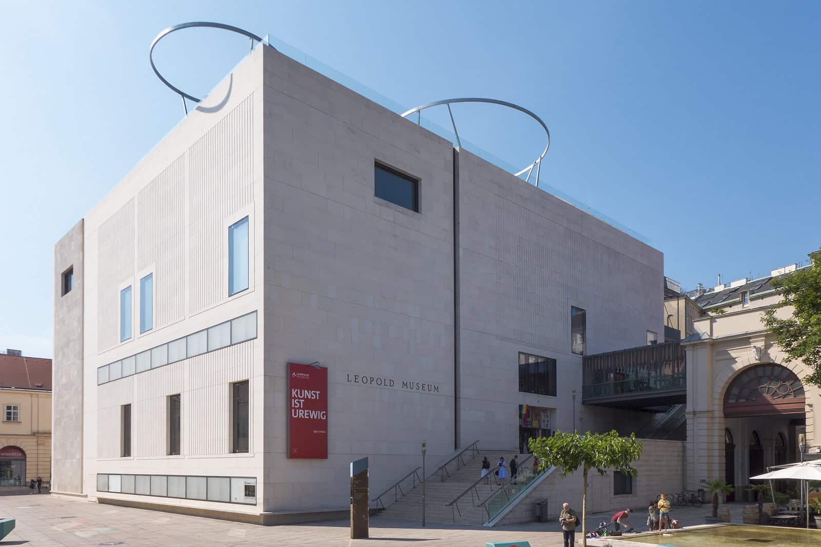The white stone facade of the Leopold Museum faces the MuseumsQuartier courtyard in Vienna.