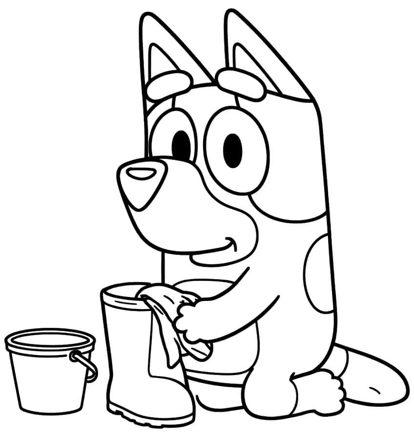 Smiling pup wiping a tall rain boot with a cloth, with a small bucket beside it