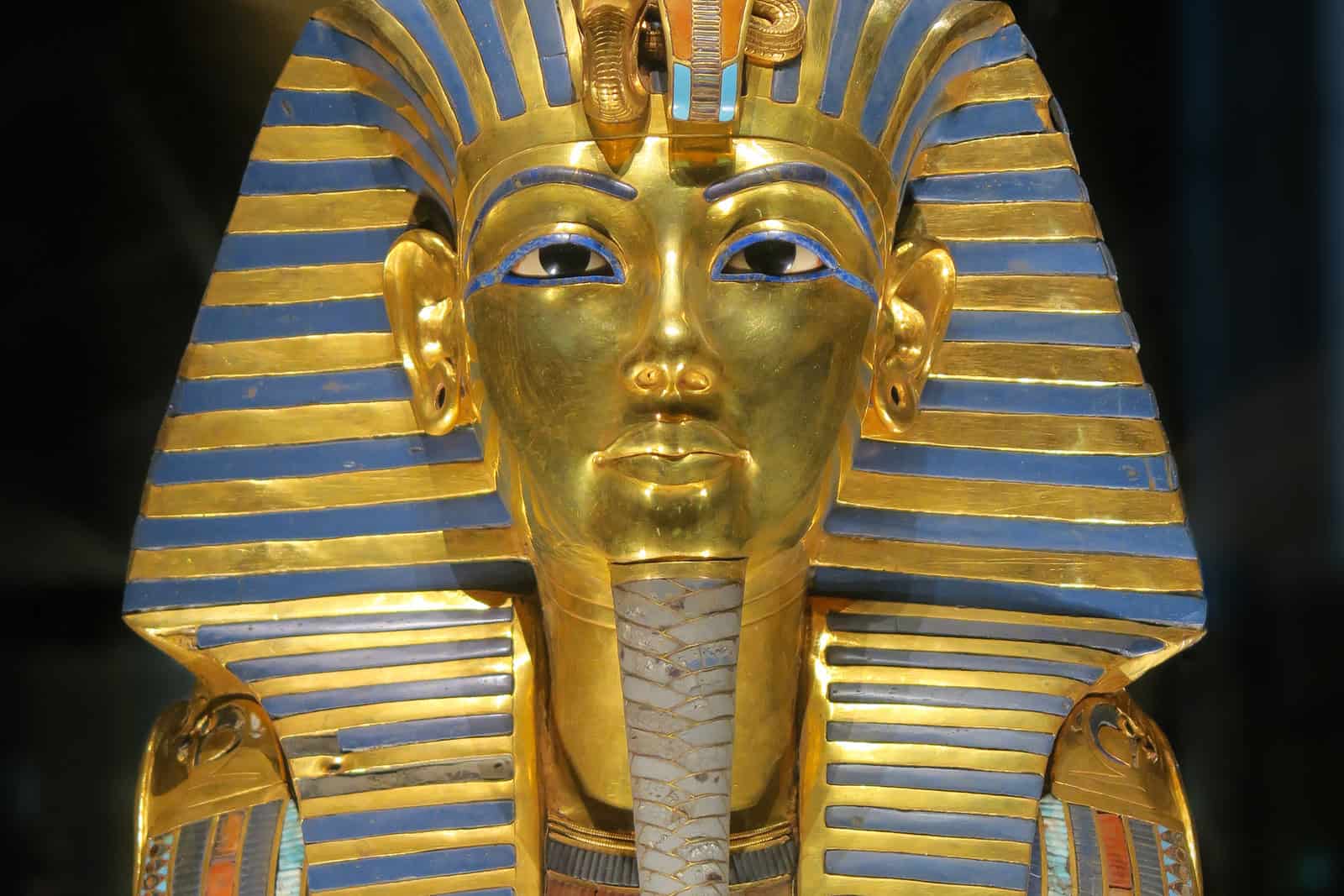 Tutankhamun’s gold funerary mask with its striped nemes headdress.