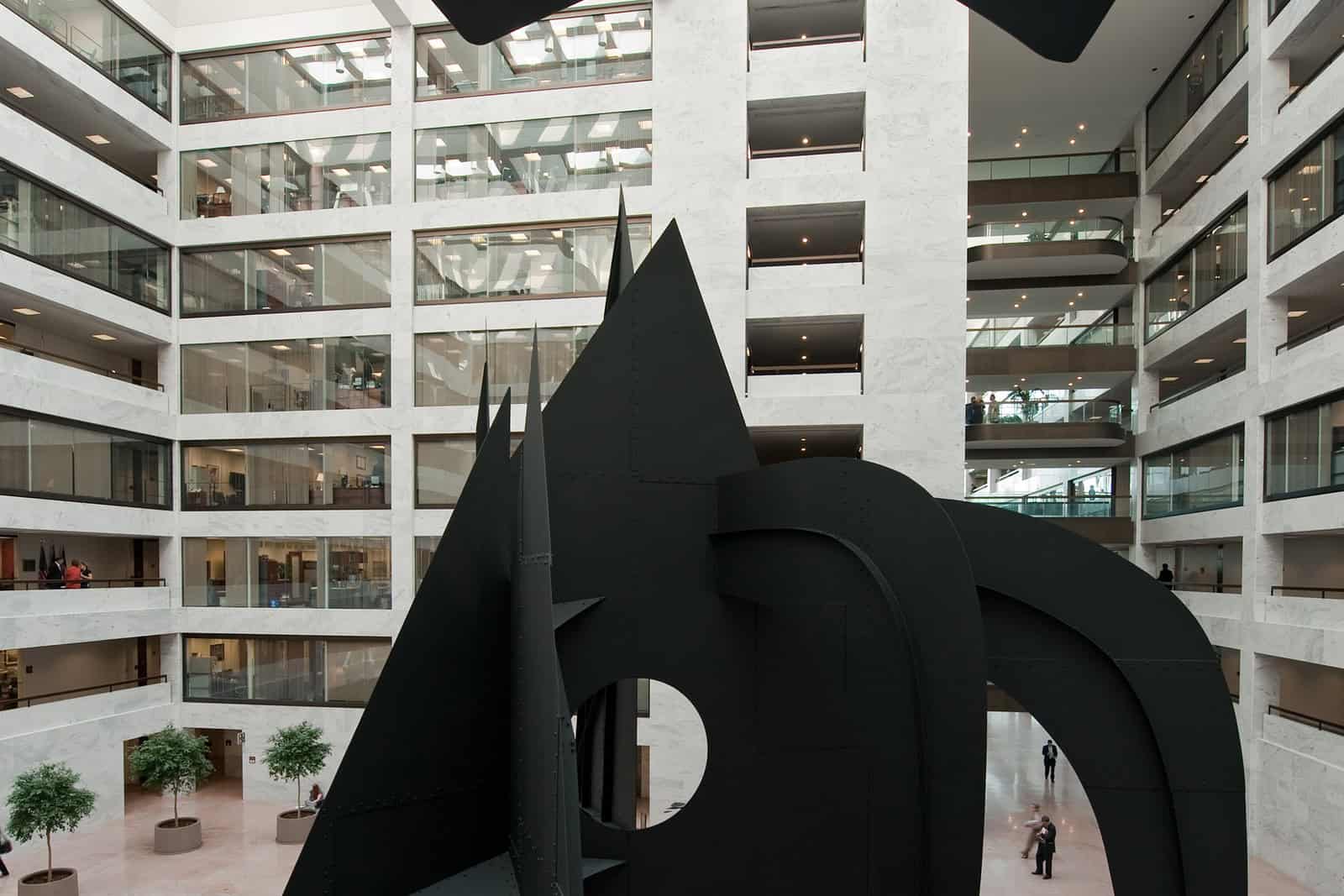 Alexander Calder’s black cloud mobile hangs above the steel mountains in the white Hart Senate Building atrium before its removal.