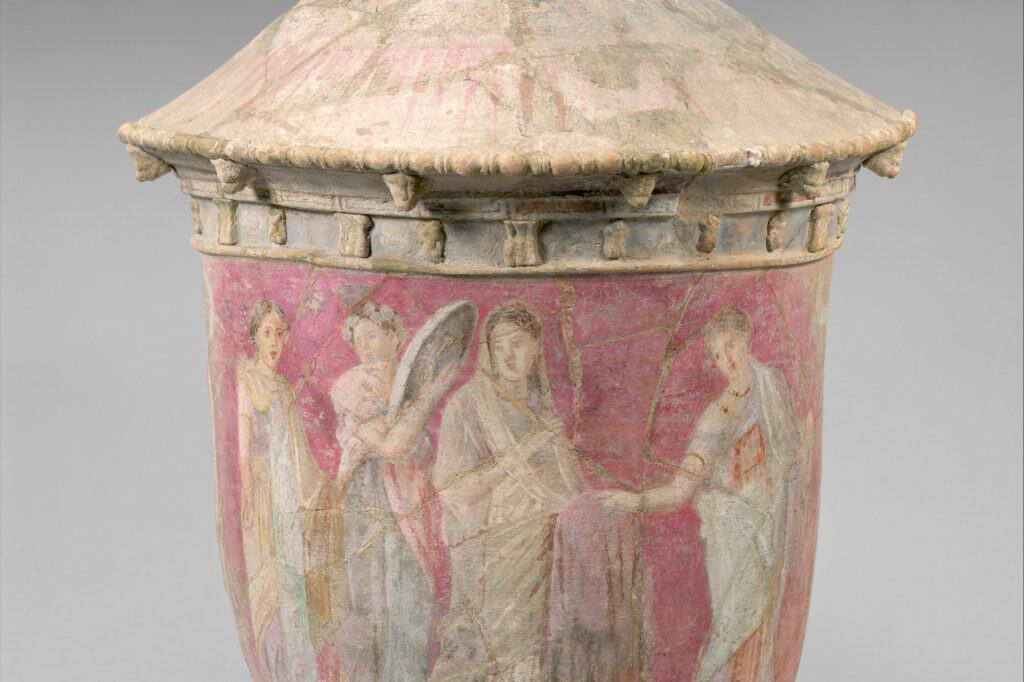 A tall terracotta Centuripe funerary vase painted with a bride and attendants.