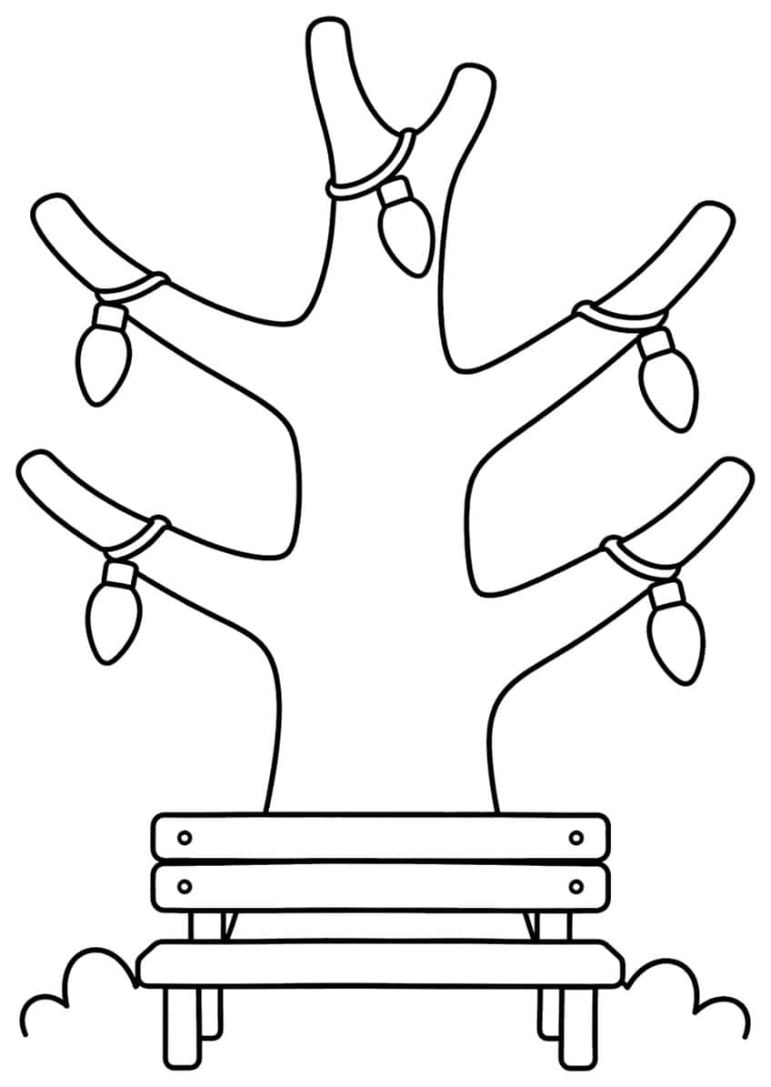 Bare tree with five hanging Christmas bulbs behind a wooden bench and small bushes
