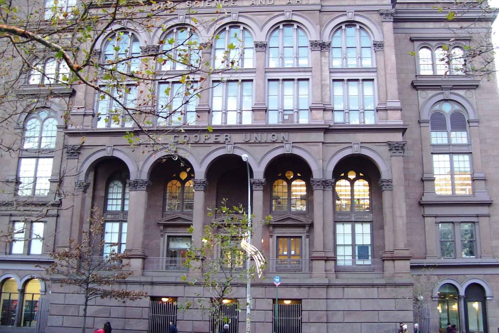The brownstone façade and arched entrance of Cooper Union’s Foundation Building on Astor Place.