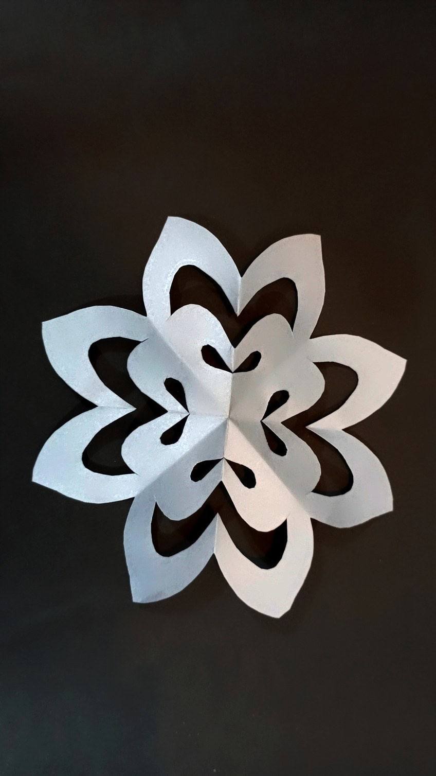 Kirigami snowflake cut from a single folded sheet of paper