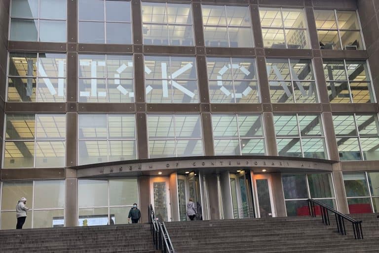 A wide staircase rises toward the entrance of the Museum of Contemporary Art Chicago.