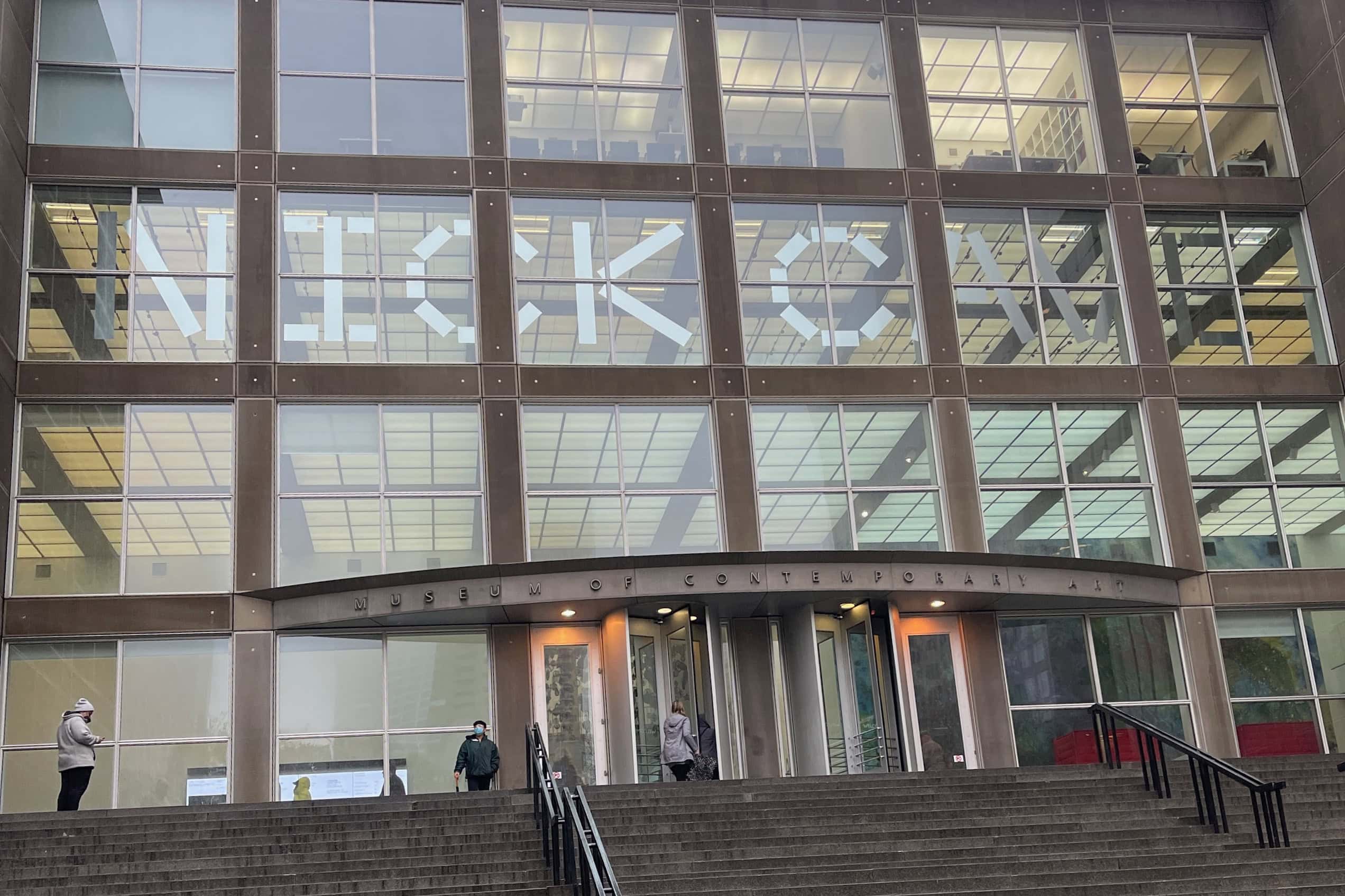 A wide staircase rises toward the entrance of the Museum of Contemporary Art Chicago.