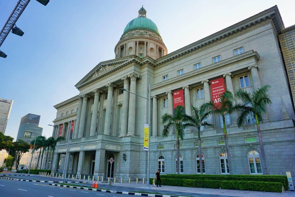 The neoclassical façade and dome of National Gallery Singapore seen from outside.