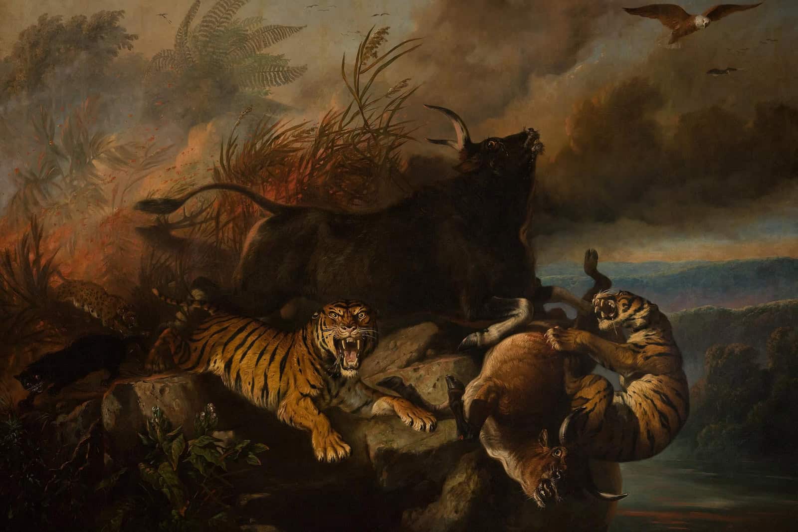 Animals flee through a dramatic burning landscape in Raden Saleh’s 1849 painting Boschbrand.