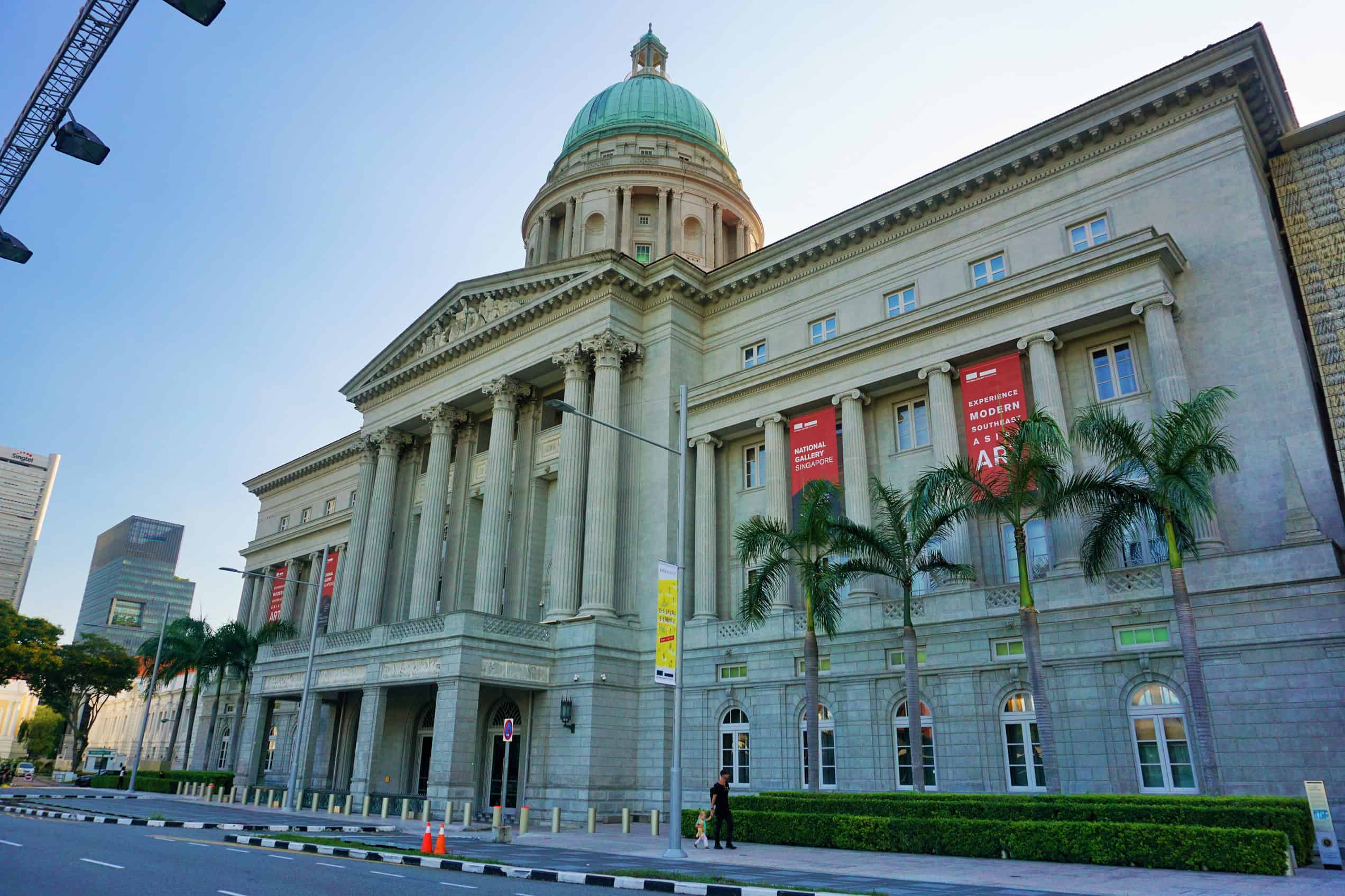 The neoclassical façade and dome of National Gallery Singapore seen from outside.