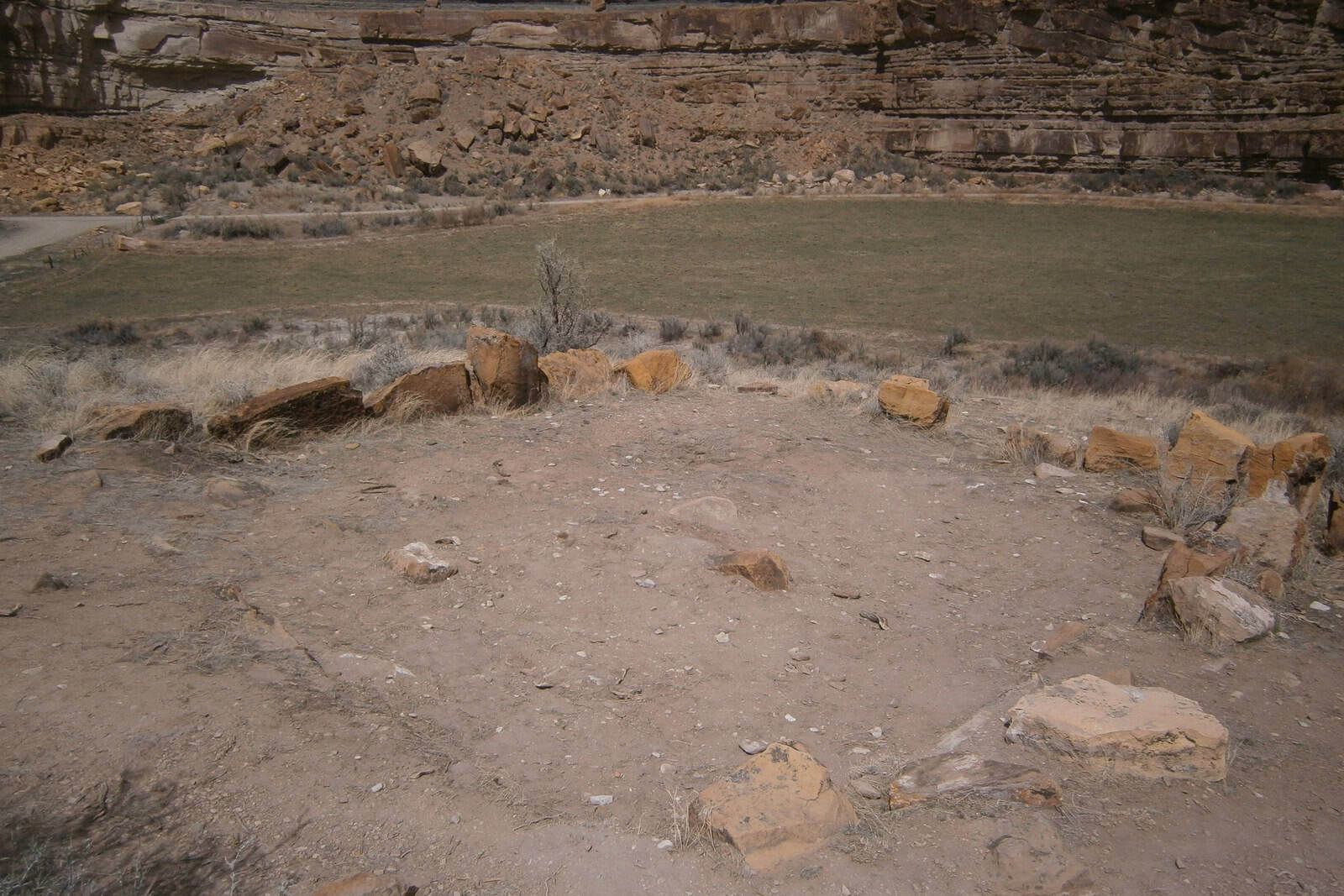 Stone remnants outlining a Fremont pit house at Cottonwood Village in Nine Mile Canyon.