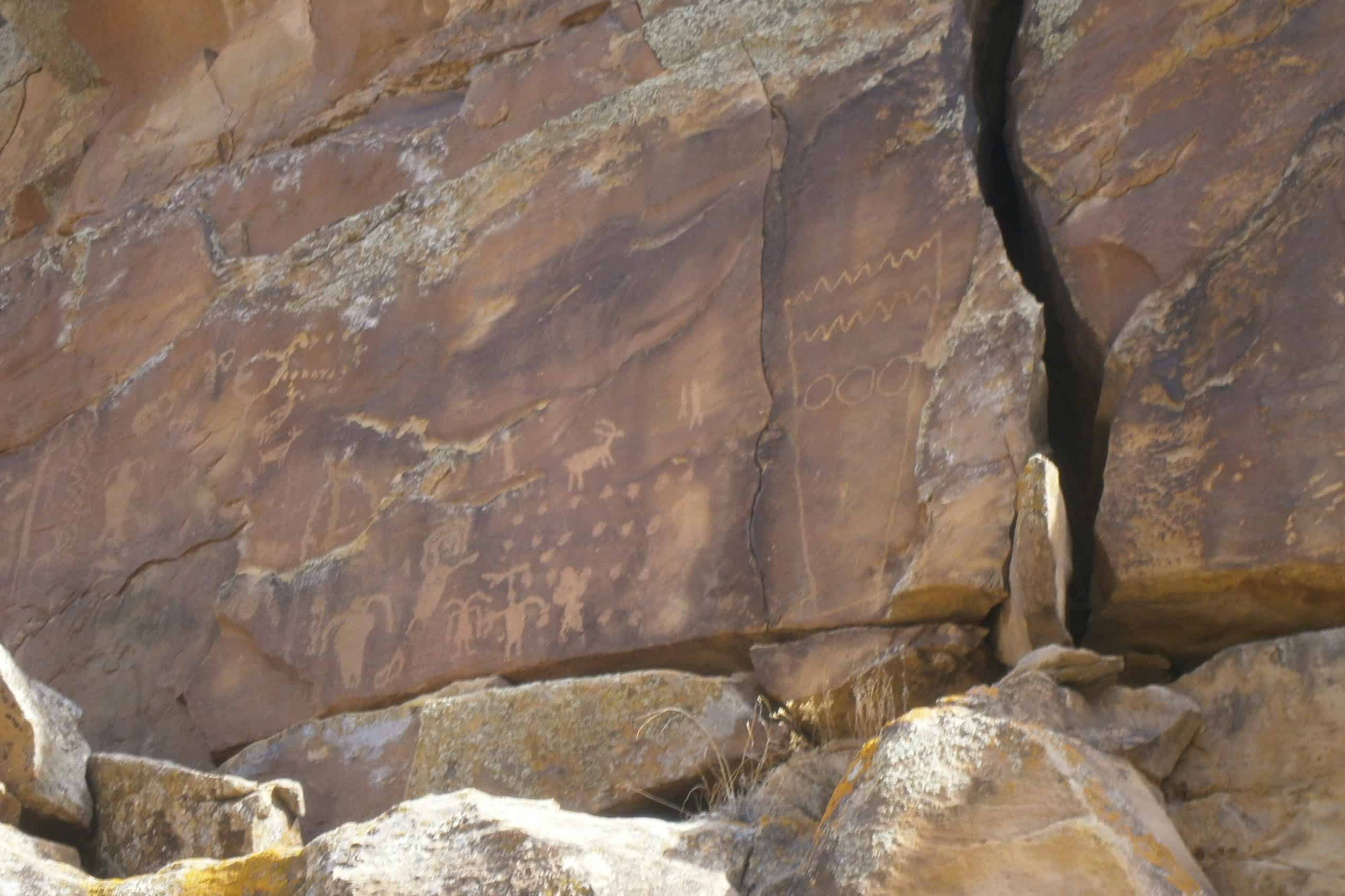 A petroglyph panel carved into dark sandstone at First Site in Utah’s Nine Mile Canyon.
