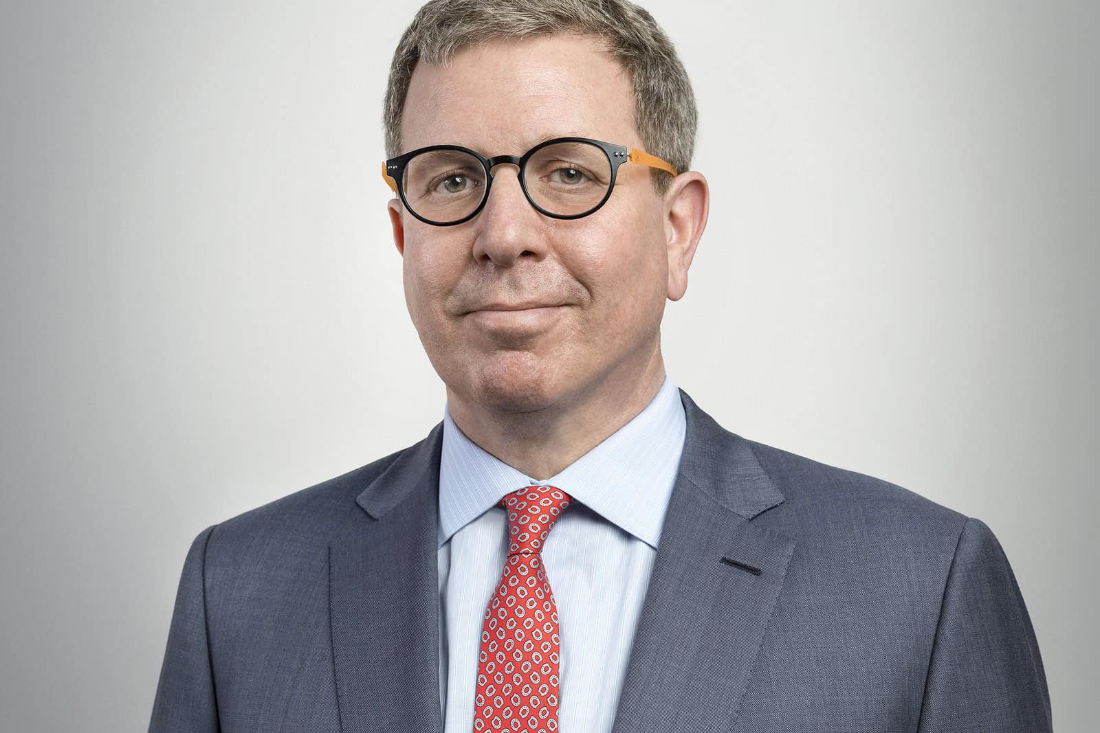 Marc Glimcher faces the camera in a formal studio portrait.