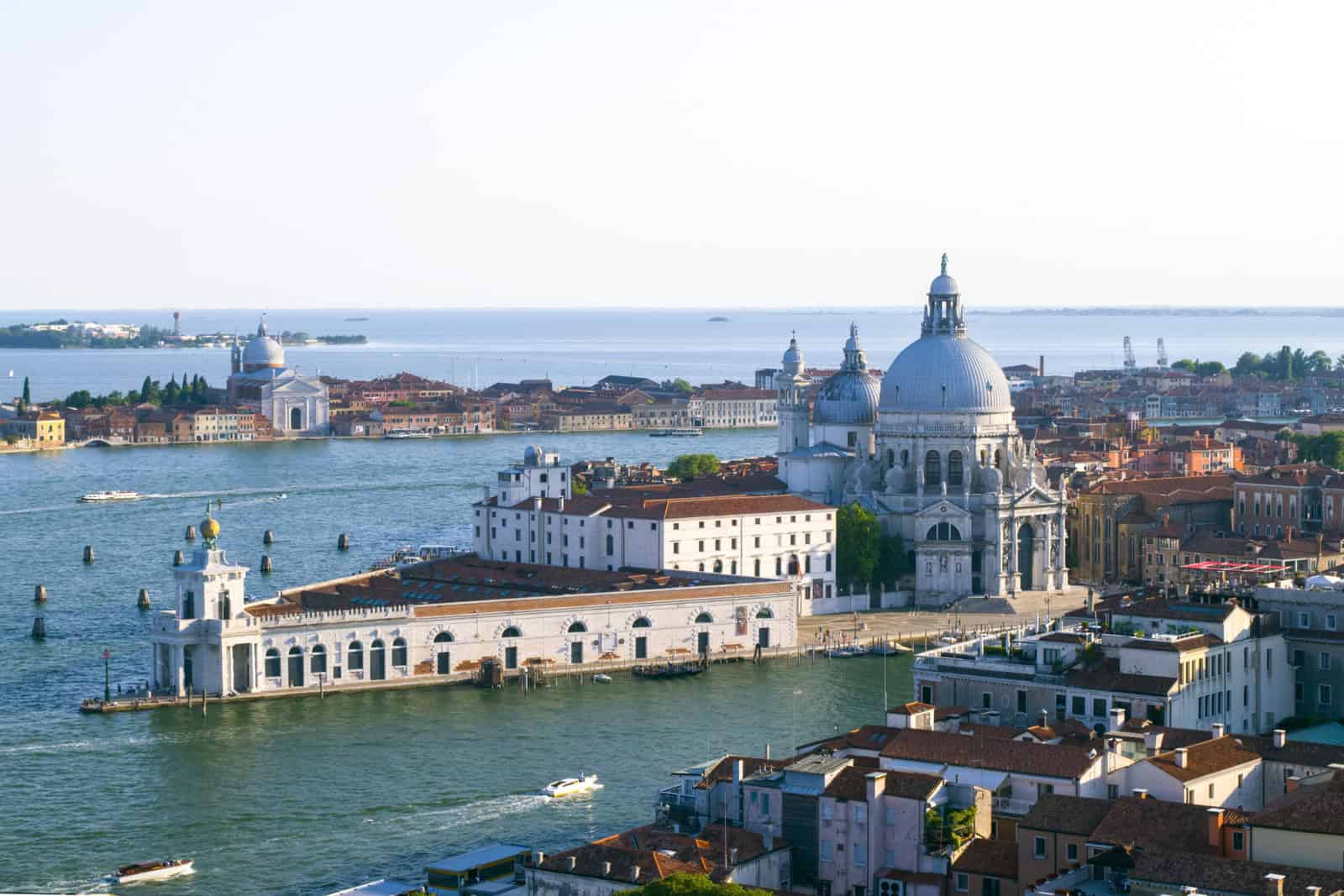 Punta della Dogana’s triangular customs-house complex projects into the water in Venice.