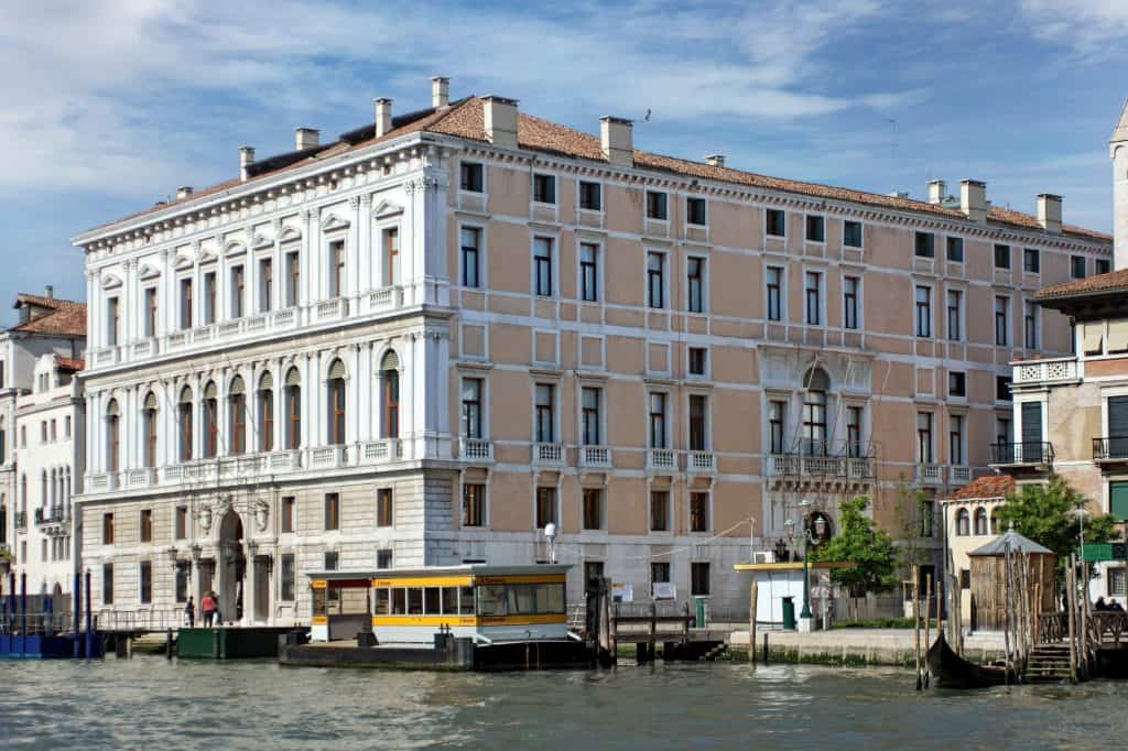 The white façade of Palazzo Grassi faces the Grand Canal in Venice.