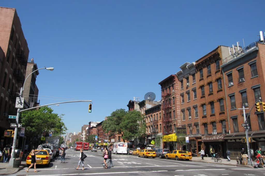 A daytime streetscape at First Avenue and East 10th Street in Manhattan’s East Village.