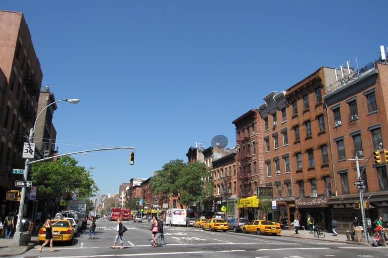 A daytime streetscape at First Avenue and East 10th Street in Manhattan’s East Village.