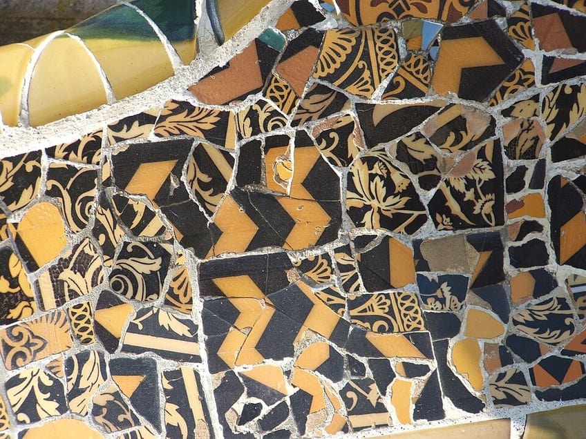 Trencadís mosaic made of broken ceramic tiles at Park Güell in Barcelona, designed by Antoni Gaudí
